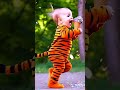 A baby running while wearing a tiger costume and eating ice cream #ai #baby #cute