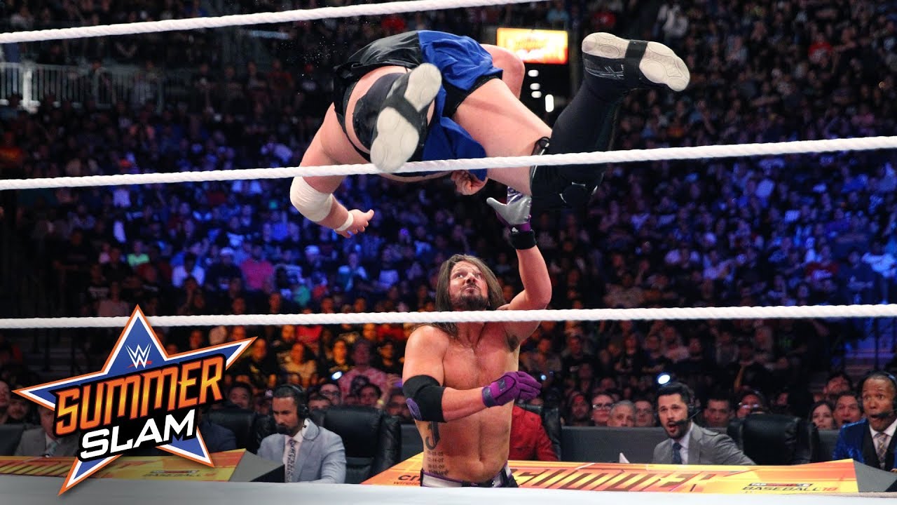 samoa joe flattens aj styles with stunning dive from the ring