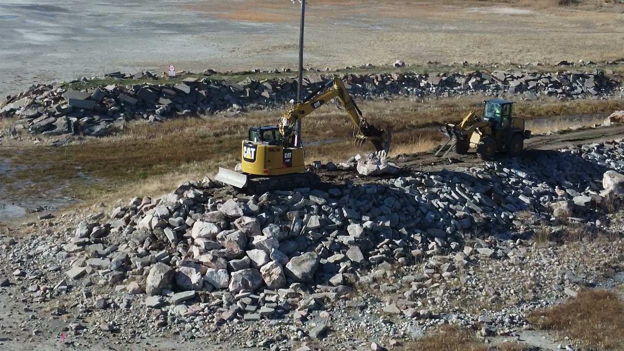VIdeo - Placing rip rap on the north jetty. - YouTube