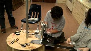 Minibot (attempting to) climb pole (FRC 2011)