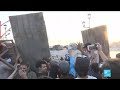 Protesters seal off Baghdad bridges as thousands join general strike