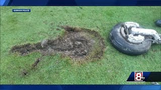Part of plane's landing gear breaks off, falls on to Maine golf course