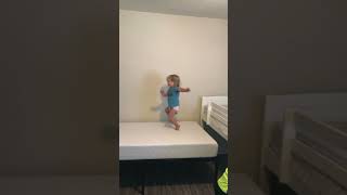 Kid jumps from top of bunk bed onto another then falls off and lands on head