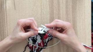 Purl 2 together through back loops (p2tog-b)