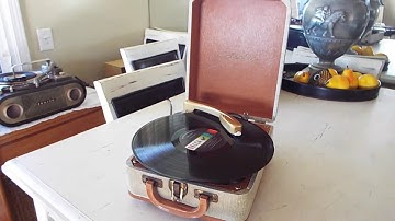 Columbia portable record player playing an LP, 33.3 RPM record.
