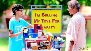 Kid Selling His Toys For Charity