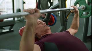 An Older Man Lifting Weights In A Gym - Free To Use Footage