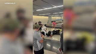 2 charged after brawl at O'Hare Airport baggage claim