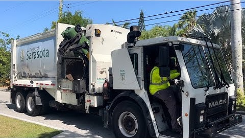 City of Sarasota Mack LR McNeilus MA Side Loader Garbage Truck On A Millionaire Street