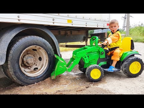truck-stuck-in-the-mud---rubble-ride-on-power-wheels-tractor-to-help