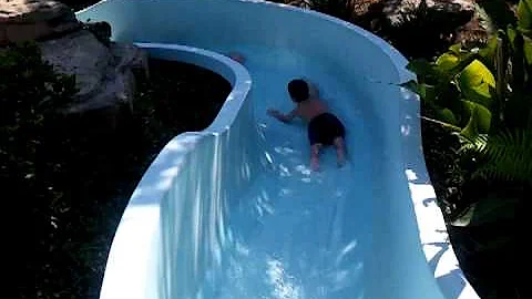 3 kids on a waster slide!