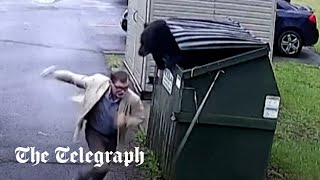 video: Watch: Teacher comes face-to-face with black bear stuck in a school bin