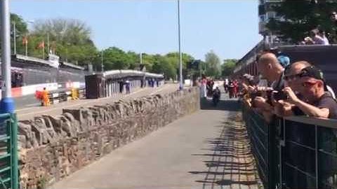 Ian Hutchison wins supersport TT race 1 and crosses the finish line at the granstand