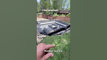 A sunken firepit that’s ready for any weather. 💧🔥