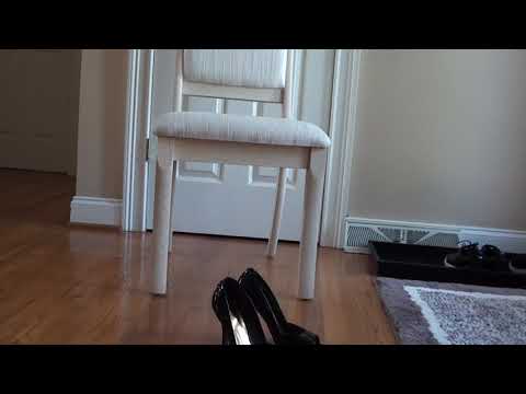 Foot fetish. Heels dangling in pantyhose.