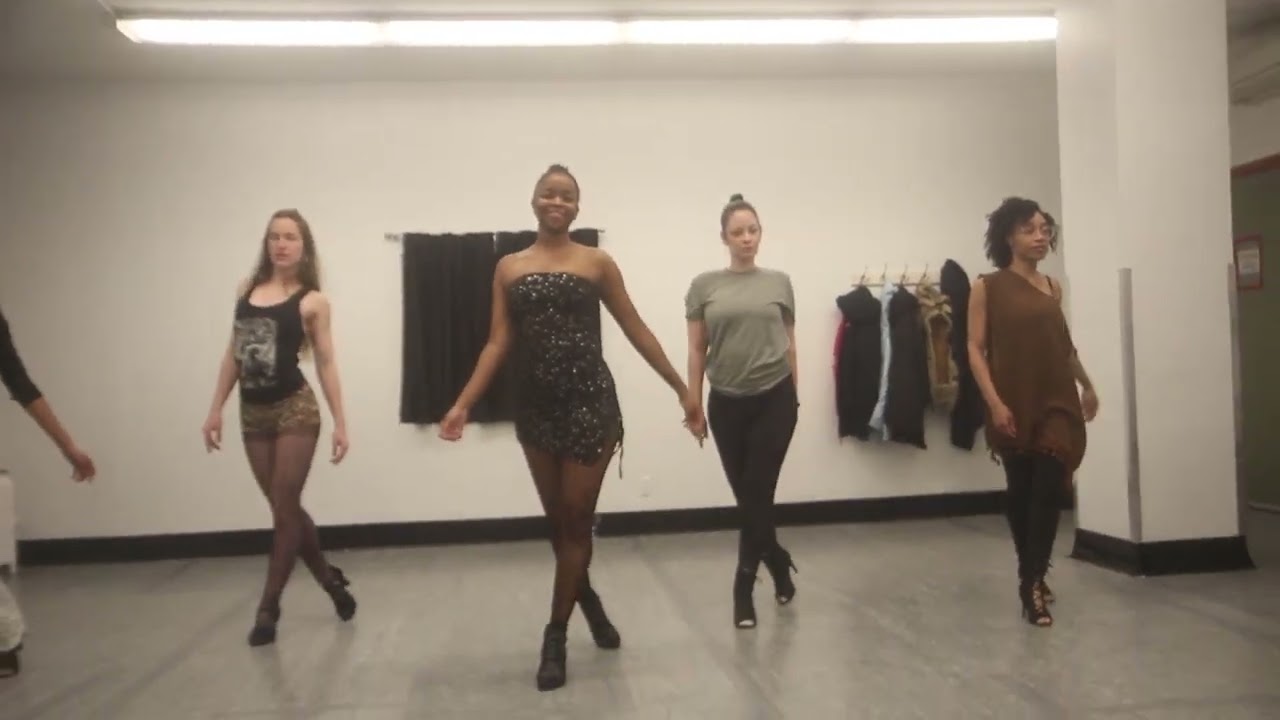 Practicing the "walk" in heels class 