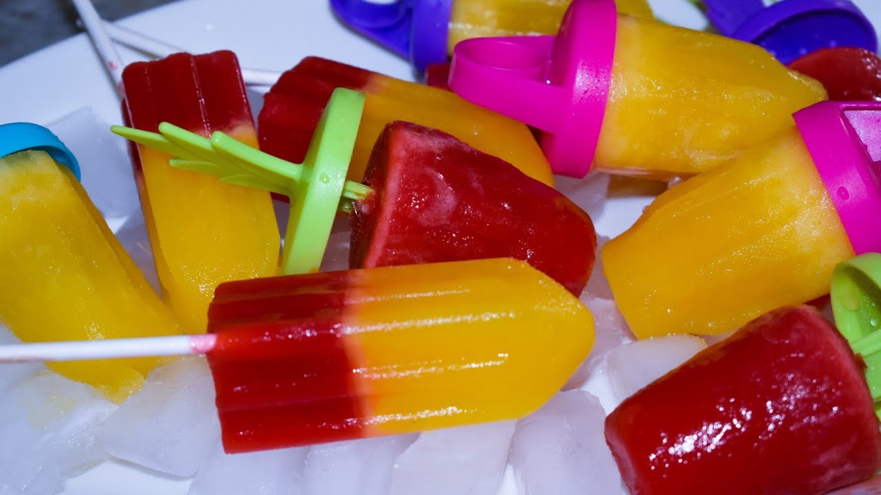 Fresh strawberry and pineapple popsicles with Ivanna.  Fun way to get your kids to eat their fruit.