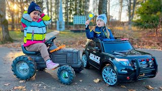 The police officers Andrey and Vika play police and catch the offender on blue tractors, with Andrey