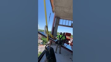 Workers Drop Heavy Glass Window Off High Rise Building - 1240028