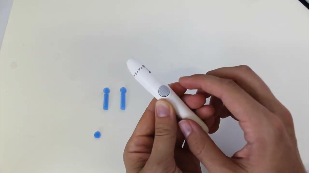 How to load a glucose lancet Wellbeing Blood Glucose Monitoring System (AG607) YouTube