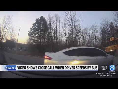 Video shows driver ignore school bus stop sign as girl prepared to cross