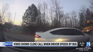 Video shows driver ignore school bus stop sign as girl prepared to cross