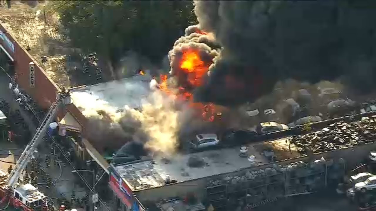 Fire burns through tire shop in Jamaica, Queens - YouTube