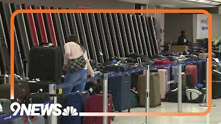 RAW: Luggage piles up at United Airlines baggage claim at Denver airport