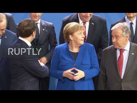 "Where"s Putin?" - Group photo delayed as Merkel, Macron search for Russian president