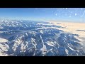 Flying Over Snowy Mountains. Italy. Flight from London to Milano