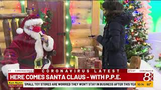 Santa arrives with personal protective equipment at Cabela's