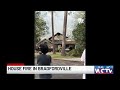 Flames erupt through roof of Thornridge Lane home, firefighters say