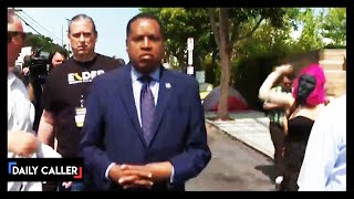 Woman In Gorilla Mask Throws Egg At Larry Elder
