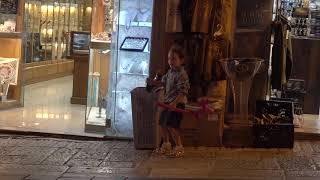 20180808 20:10 a boy is blowing a horn in the Pedestrian Street Jerusalem 0:32