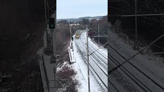 (First catch of the year) Class 331/1 Civity passing under a footbridge near Macclesfield
