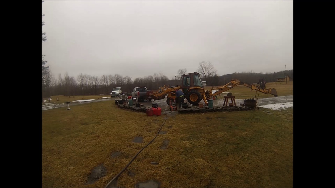 Cleaning the case 580e   with the pressure washer
