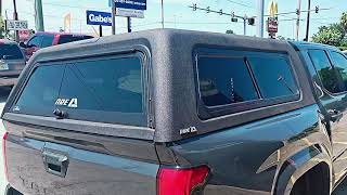 Install of an A.R.E. CX Series cap + OTR upgrade on this Tacoma. Rugged, clean, and ready to roll!