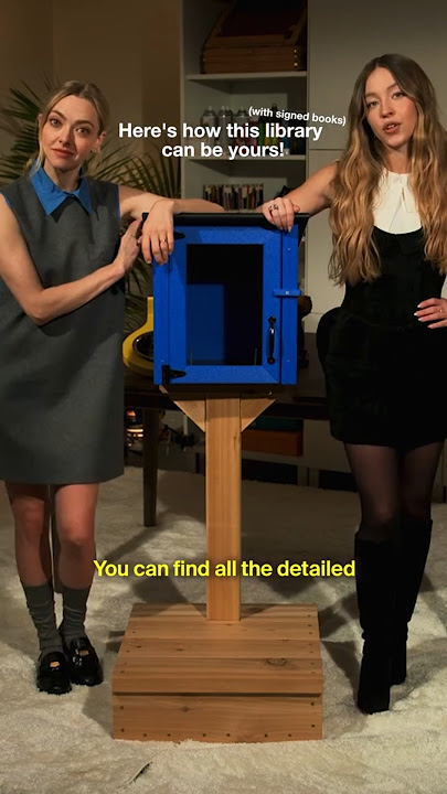 Amanda Seyfried and Sydney Sweeney building Little Free Library