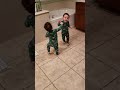 Twins love playing in bathroom