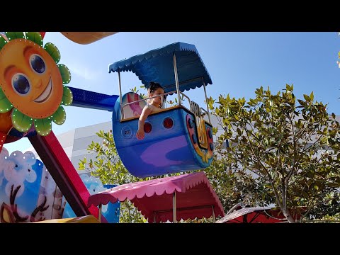 Playing in carousel - Outside playground