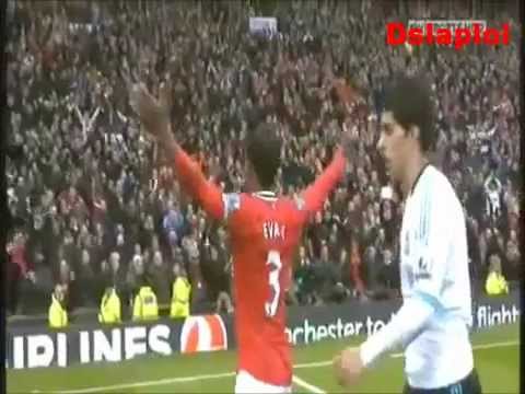 Patrice Evra boosting and celebrates in front of Luis Suarez