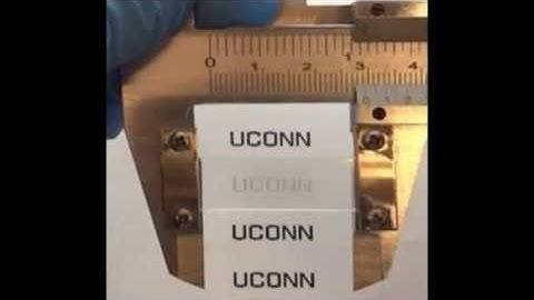 Bio-inspired sensitive and reversible mechanochromisms via strain-dependent cracks and folds