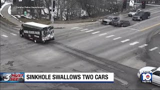 Pair of cars sitting at red light suddenly swallowed into sinkhole
