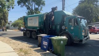 La sanitation truck 36964 on the trash route