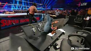 Undertaker chokeslams Shawn Michaels on the announce table