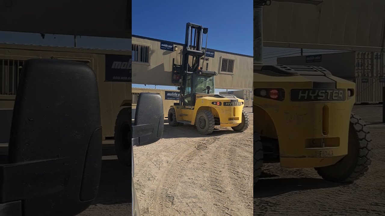 Forklift Operator Moving A Container