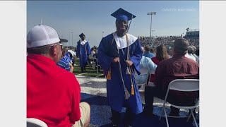 Young man severely burned as child graduates
