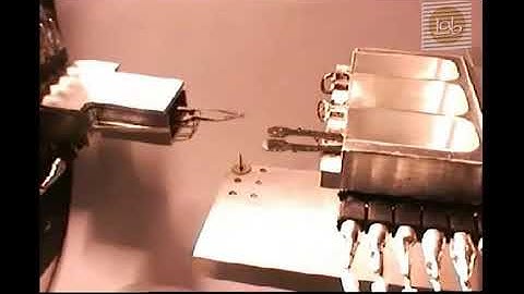 Automated tool changer for robotic micro-assembly