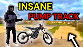 SURRONS Ride An INSANE Pump Track!! // Jumps, Wheelies & Race