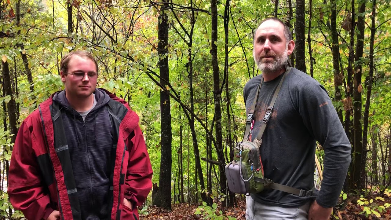 Boy Scout Sam Hess - talks to the first trout fisherman to use the new bridges that Sam built
